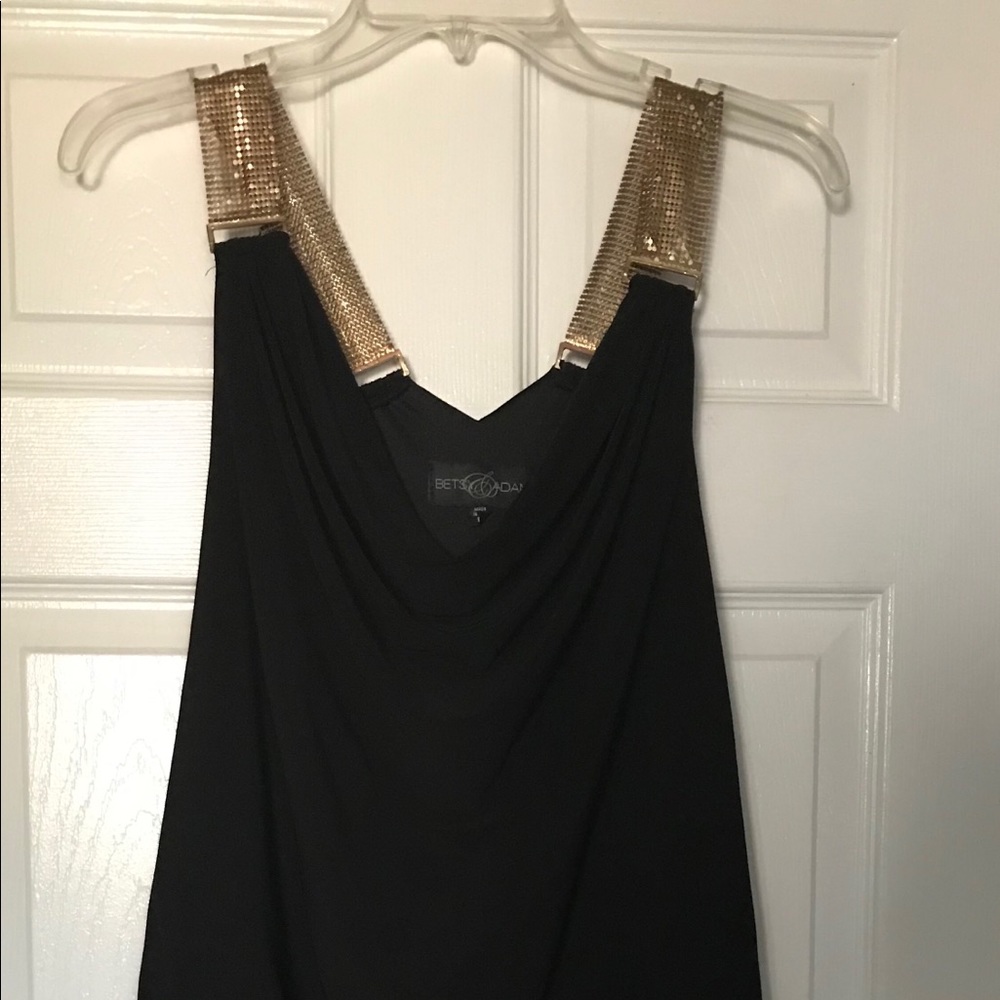 Black mini dress with gold metallic straps